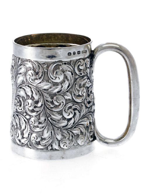 a deeply embossed silver half pint christening mug - CATEGORY: ANTIQUE SILVER - DATED 1890