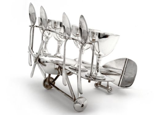 rare silver plate biplane holding four egg cups and four teaspoons - CATEGORY: ANTIQUE SILVER - DATED 1930