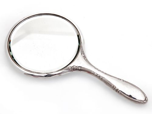 ANTIQUE SILVER CIRCULAR HAND MIRROR WITH A DELICATE FLORAL BORDER - ADDITIONAL PHOTO 1