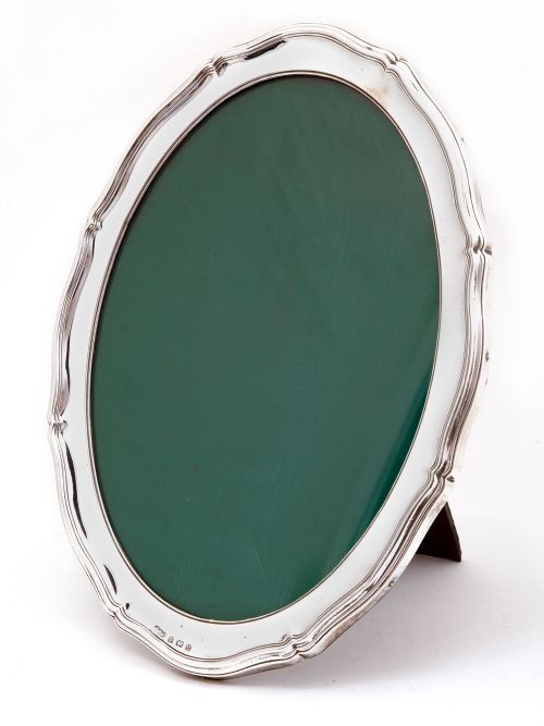 antique oval silver photo or picture frame with a chippendale border - CATEGORY: ANTIQUE SILVER - DATED 1910