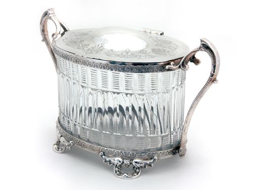DECORATIVE OVAL VICTORIAN SILVER PLATED BISCUIT BOX WITH CUT GLASS BODY HINGED LID AND HINGED HANDLES - ADDITIONAL PHOTO 1