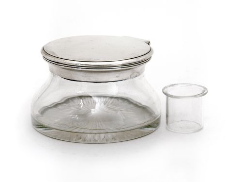 PLAIN MOUNTED EDWARDIAN CIRCULAR INK POT WITH A PLAIN HINGED LID AND A SHAPED CLEAR GLASS BODY - ADDITIONAL PHOTO 1