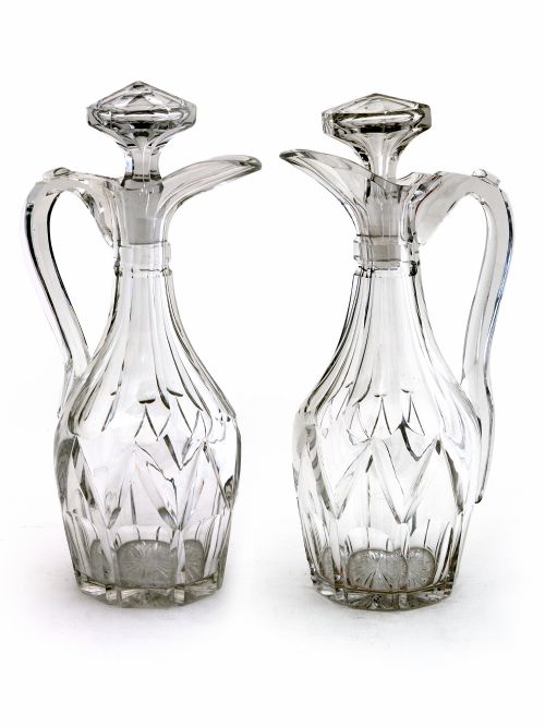 pair of victorian cut glass claret jugs with deep cut bodies and applied scroll handles - CATEGORY: ANTIQUE GLASS - DATED 1890