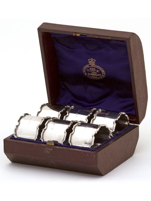 boxed set of six silver napkin rings with plain bodies and chippendale style borders - CATEGORY: ANTIQUE SILVER - DATED 1920