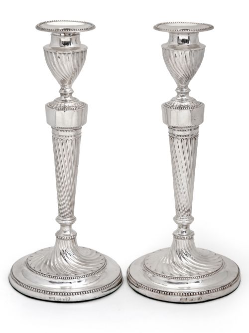 pair of victorian silver candlesticks with a fluted spiral form stem and base - CATEGORY: ANTIQUE SILVER - DATED 1880