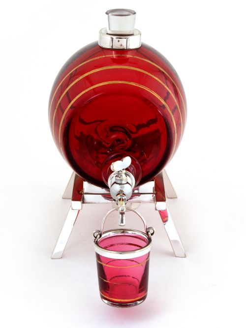 HUKIN HEATH SPIRIT BARREL WITH A SILVER PLATED SPIGOT AND CRANBERRY AND GILT GLASS BARREL - ADDITIONAL PHOTO 1