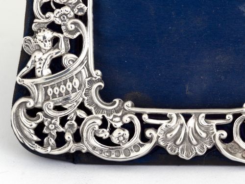 ANTIQUE SILVER WILLIAM COMYNS PHOTO FRAME DECORATED WITH FLOWERS SCROLLS AND CHERUBS - ADDITIONAL PHOTO 4