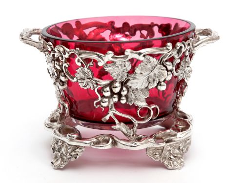 silver plate sugar basket with a cranberry glass liner and grape and vine sides - CATEGORY: ANTIQUE GLASS - DATED 1890