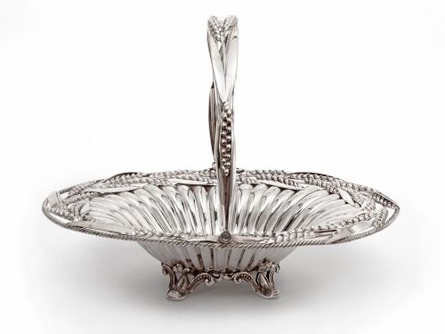 VICTORIAN OVAL SILVER PLATED SWING HANDLE BASKET WITH WHEAT AND ROPE BORDER ON FOUR CAST SCROLL FEET - ADDITIONAL PHOTO 1