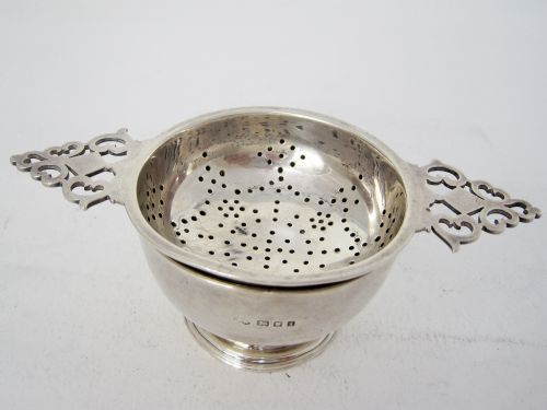 SILVER TEA STRAINER AND BOWL WITH TWO PIERCED KEYHOLE STYLE HANDLES - ADDITIONAL PHOTO 1