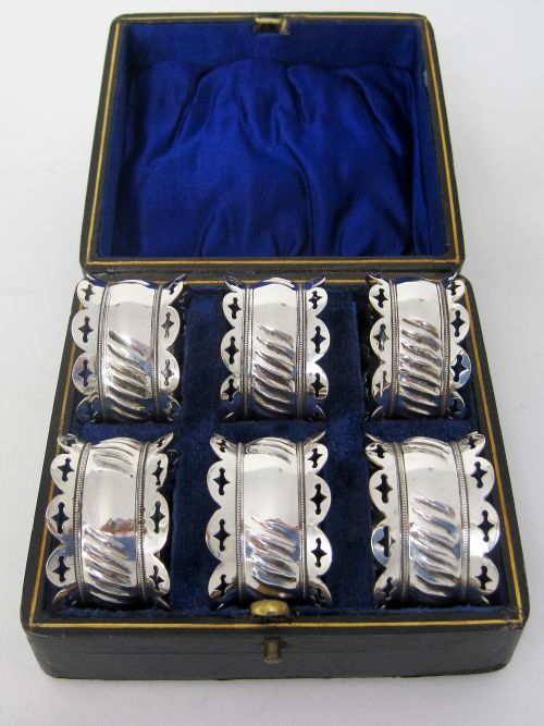 BOXED SET OF SIX LATE VICTORIAN SILVER PLATED NAPKIN RINGS - ADDITIONAL PHOTO 1