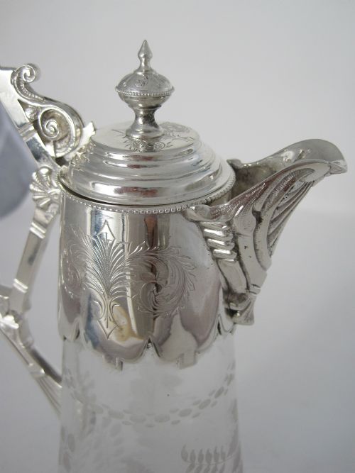 VICTORIAN SILVER PLATED CLARET JUG WITH CAST FLUTED SPOUT AND AN UNUSUAL STYLISED HANDLE - ADDITIONAL PHOTO 1