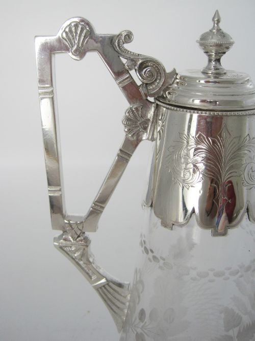 VICTORIAN SILVER PLATED CLARET JUG WITH CAST FLUTED SPOUT AND AN UNUSUAL STYLISED HANDLE - ADDITIONAL PHOTO 2