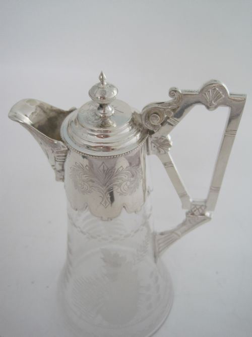 VICTORIAN SILVER PLATED CLARET JUG WITH CAST FLUTED SPOUT AND AN UNUSUAL STYLISED HANDLE - ADDITIONAL PHOTO 7