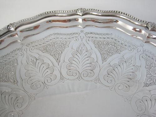12 VICTORIAN SILVER PLATED SALVER IN A SHAPED CIRCULAR FORM - ADDITIONAL PHOTO 1