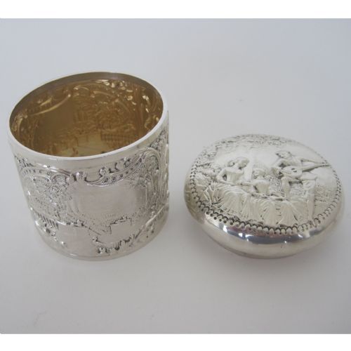 DECORATIVE VICTORIAN SILVER VANITY JAR OR BOX WITH MUSICAL THEME EMBOSSED LID - ADDITIONAL PHOTO 2
