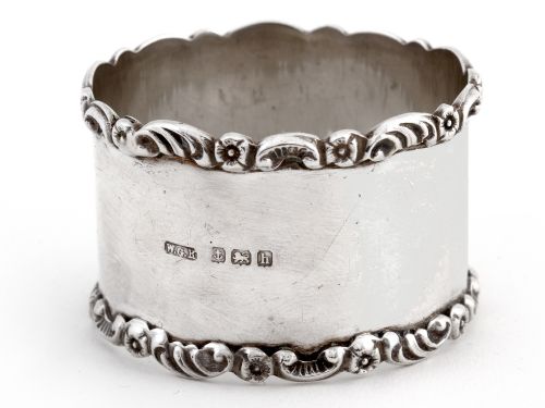 PAIR OF BOXED EDWARDIAN SILVER NAPKIN RINGS WITH PLAIN BODIES AND FLORAL AND SCROLL BORDERS - ADDITIONAL PHOTO 2