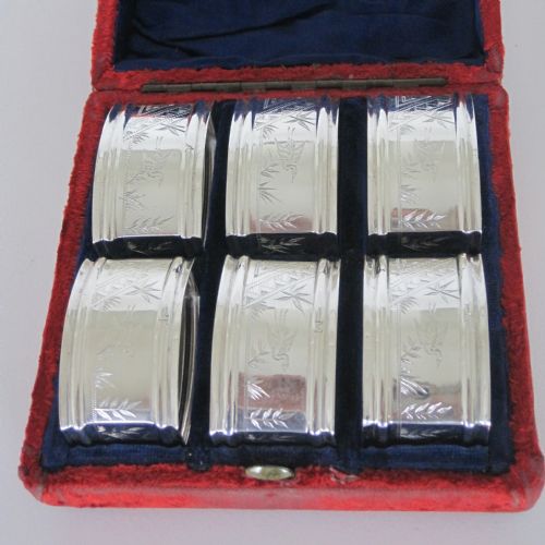 BOXED SET OF SIX AESTHETIC MOVEMENT SILVER PLATED NAPKIN RINGS - ADDITIONAL PHOTO 1