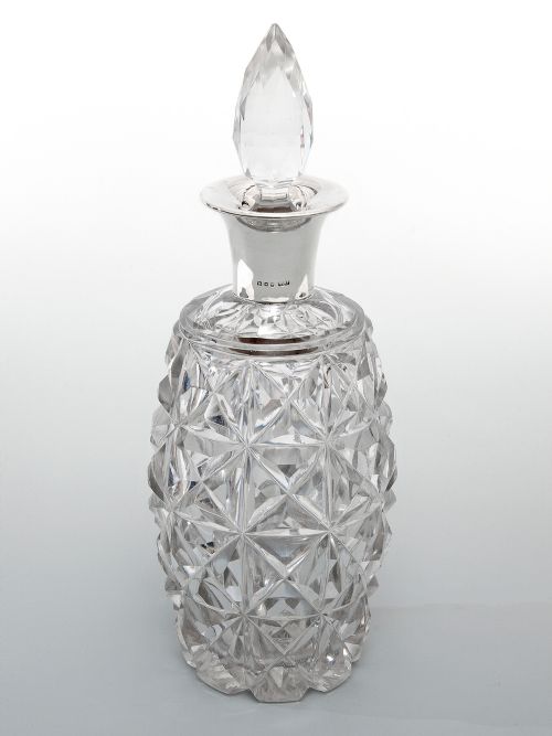 heavy silver mounted decanter with a glass barrel shaped body - CATEGORY: ANTIQUE SILVER - DATED 1920