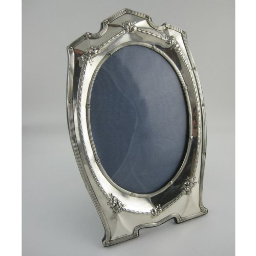 large antique silver photo frame in oval shaped form - CATEGORY: ANTIQUE SILVER - DATED 1920