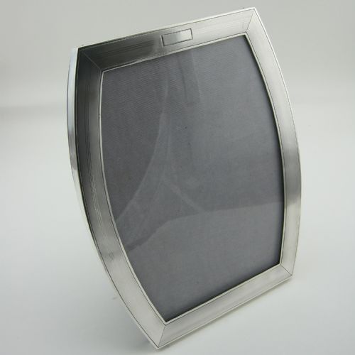stylish sterling silver photo frame in a shaped oval form - CATEGORY: ANTIQUE SILVER - DATED 1940