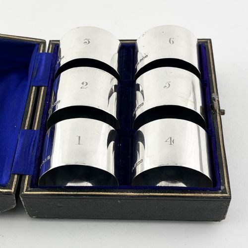 SIX PLAIN EDWARDIAN STERLING SILVER NAPKIN RINGS IN ORIGINAL SILK LINED BOX - ADDITIONAL PHOTO 1