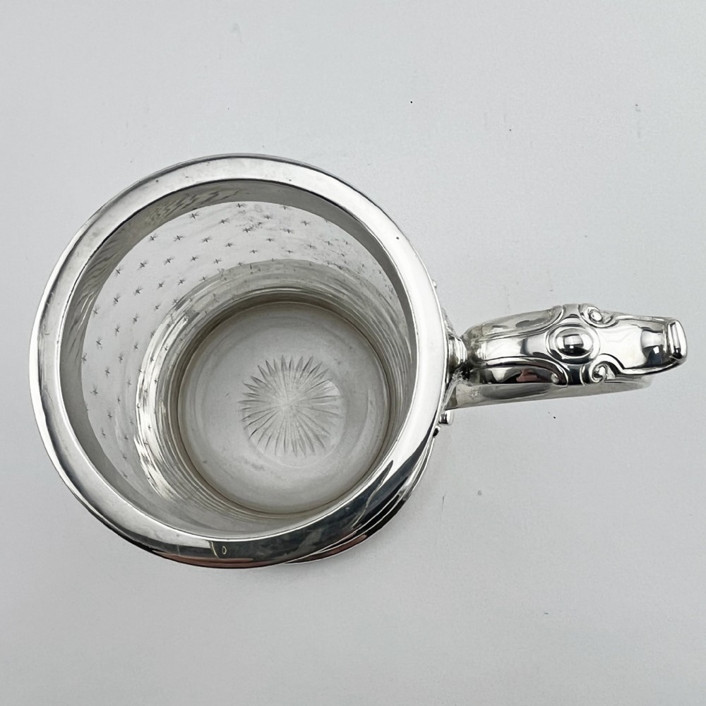 A Victorian clear glass mug featuring etched star motifs, a silver-plated rim, a stepped silver base, and a decorative scrolling handle. View III