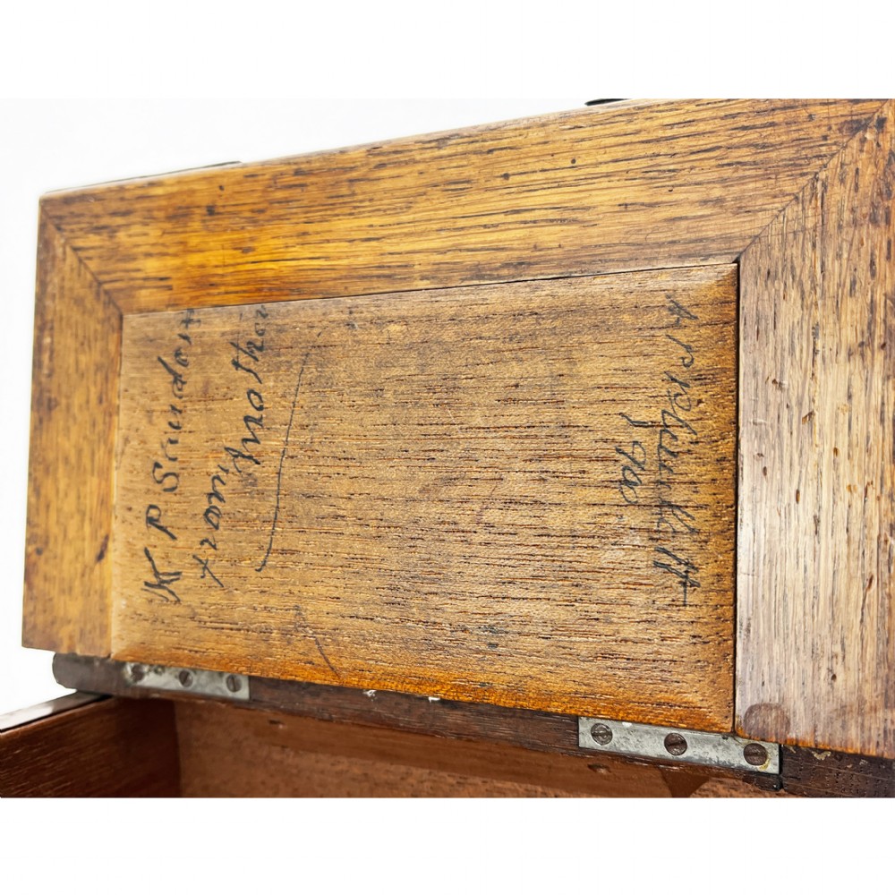 A rectangular oak wood box featuring sterling silver corner mounts and a central silver handle on the lid. View VII