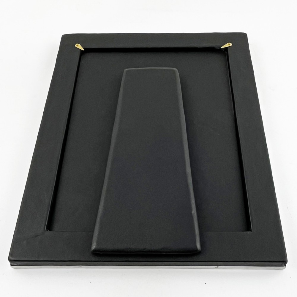 A rectangular sterling silver photo frame with a polished surface, visible hallmarks on the side edge, and a dark backing. View VI