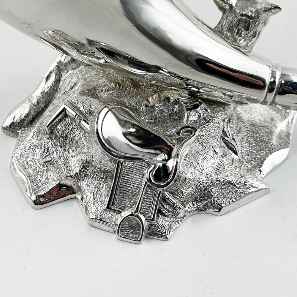 A Victorian silver-plated spoon warmer shaped like a curved horn with a sculpted animal figure at the base. View III