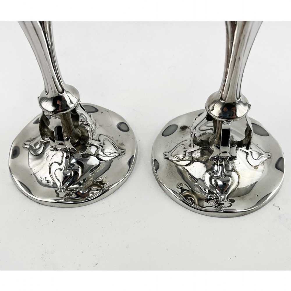 A pair of polished sterling silver Art Nouveau stem vases featuring flared scalloped rims, slender stems, and embossed floral whiplash motifs on circular bases. View III
