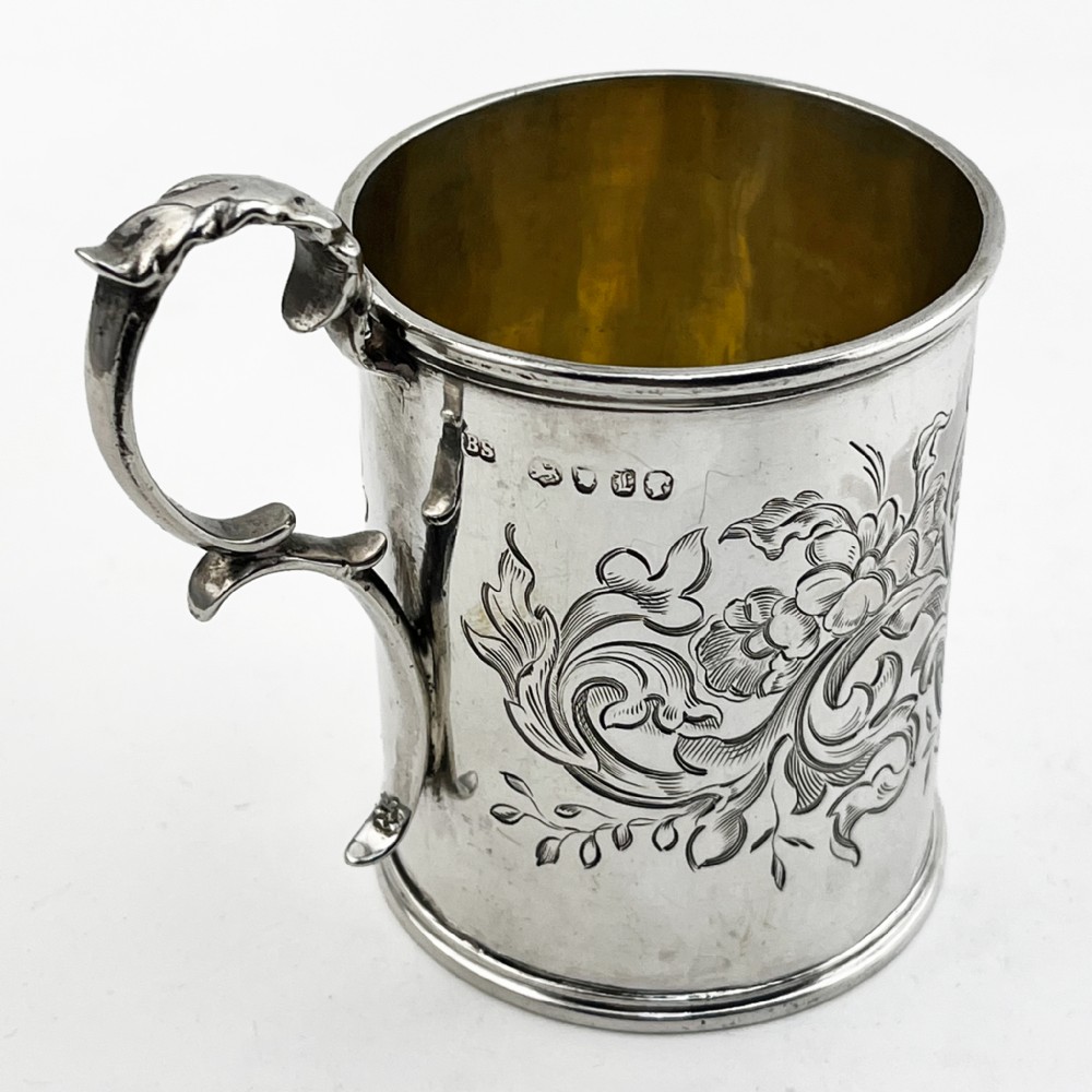 A Victorian sterling silver christening mug featuring floral engraving and a silver-gilt interior. View III