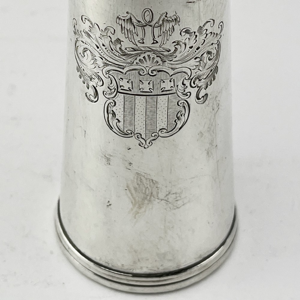 A conical Victorian sterling silver hunting saddle flask featuring an engraved coat of arms and a rounded silver cap. View II