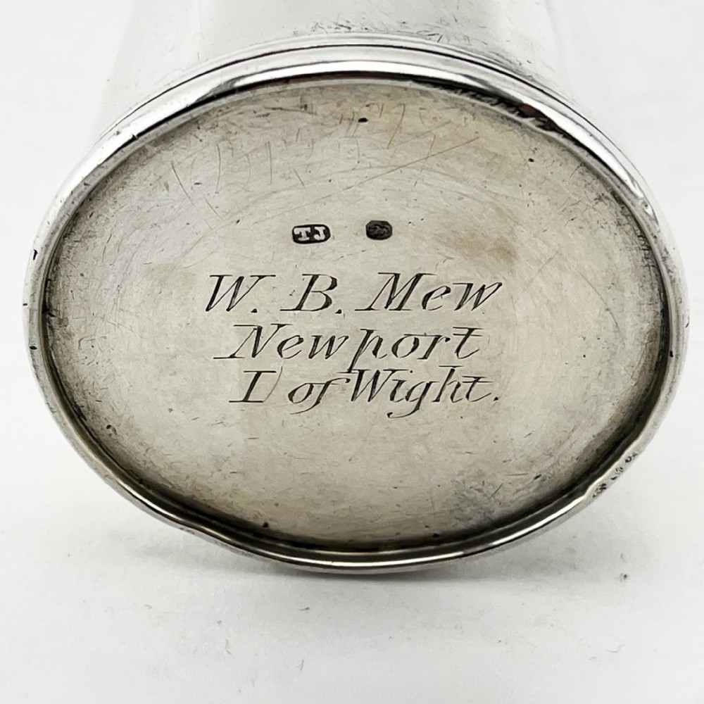 A conical Victorian sterling silver hunting saddle flask featuring an engraved coat of arms and a rounded silver cap. View V