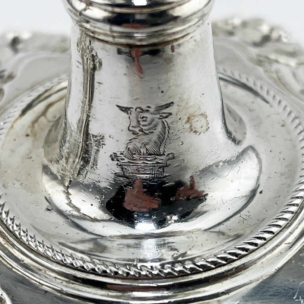 A pair of cast sterling silver George II candlesticks with shell-detailed bases and knopped stems. View V