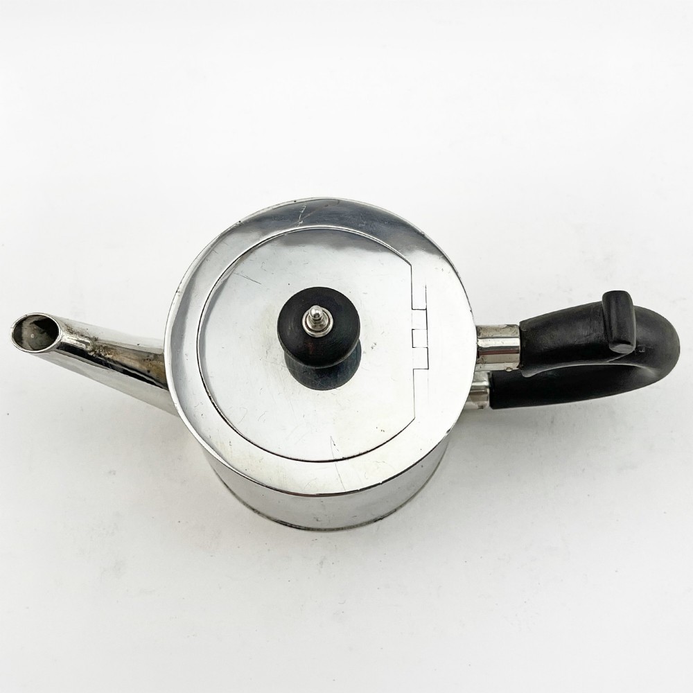 A Georgian sterling silver bachelor teapot featuring a cylindrical drum body, straight spout, and dark wooden handle and finial. View III