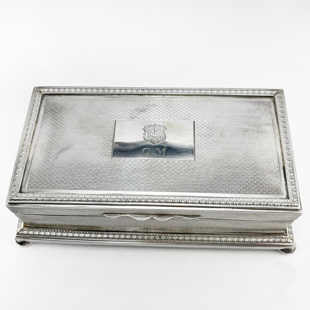 A rectangular sterling silver trinket box featuring engine-turned engraving, a beaded border, and a central engraved cartouche with initials. View II