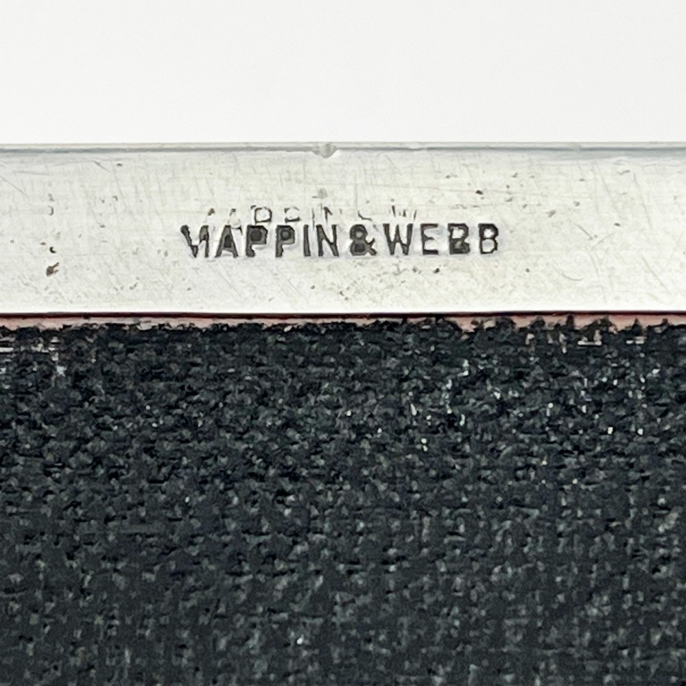 A rectangular sterling silver box featuring an engine-turned patterned lid, a central rectangular cartouche, and four stepped bracket feet. View VIII