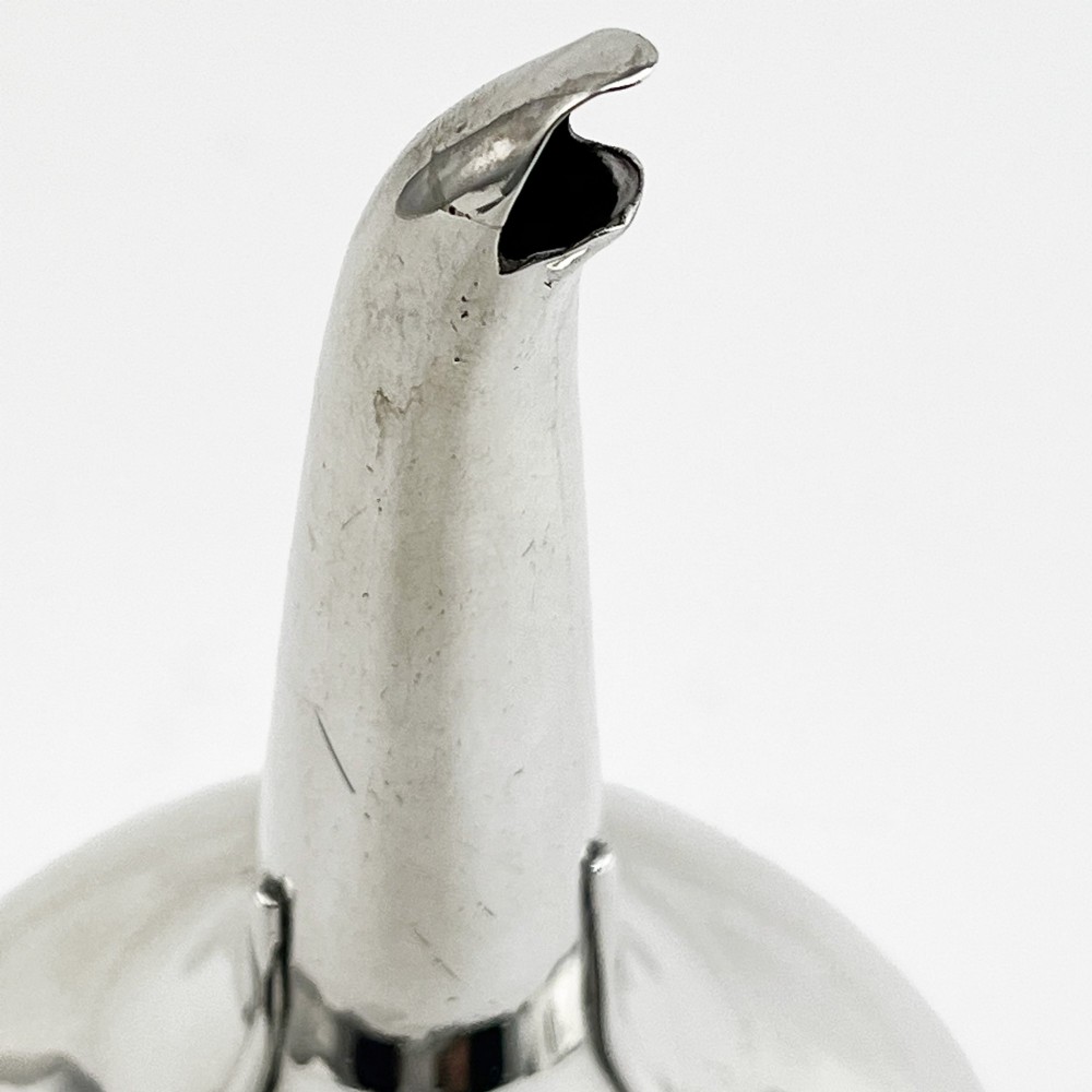 A Georgian sterling silver wine funnel resting on a beaded circular drip tray with visible hallmarks. View III