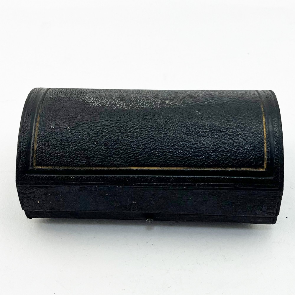 A pair of engraved Victorian sterling silver napkin rings numbered 1 and 2 inside a fitted velvet display case. View VI
