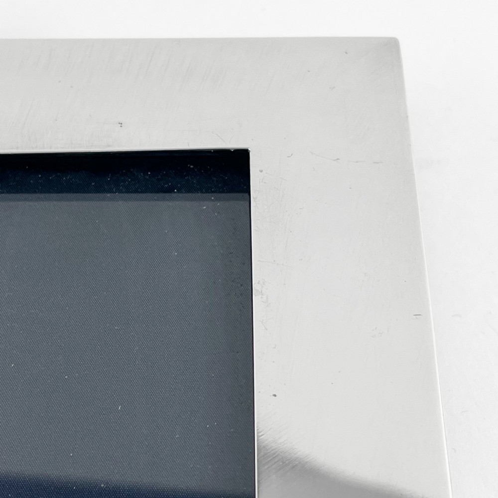 A large rectangular sterling silver photo frame with a polished finish and a carved ribbon bow crest at the top. View IX