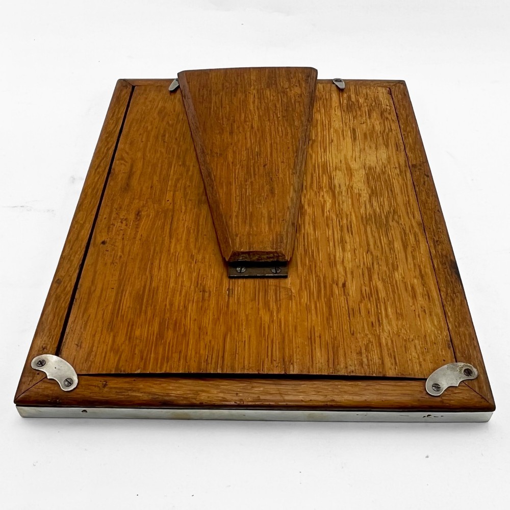 A rectangular picture frame with a mottled brown tortoiseshell border encased within a slim sterling silver outer rim. View VIII