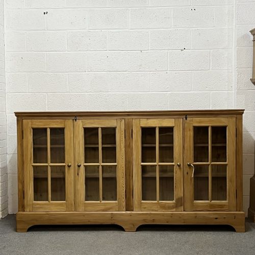 Wide & Low Antique Pine Glazed Door Waxed Bookcase