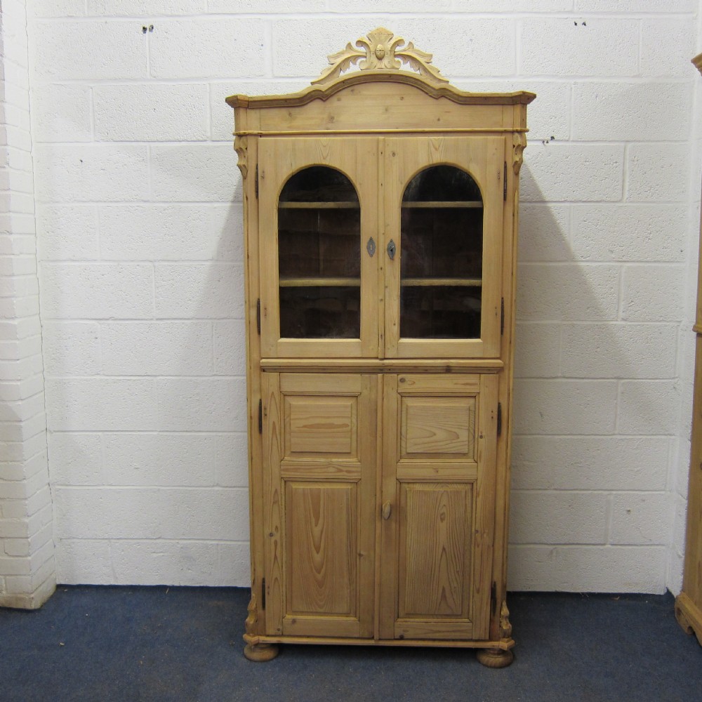 Tall arched antique pine glazed cupboard 