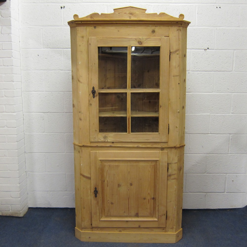 Large old pine glazed corner cupboard