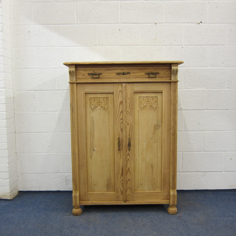 Tall slim old pine cupboard