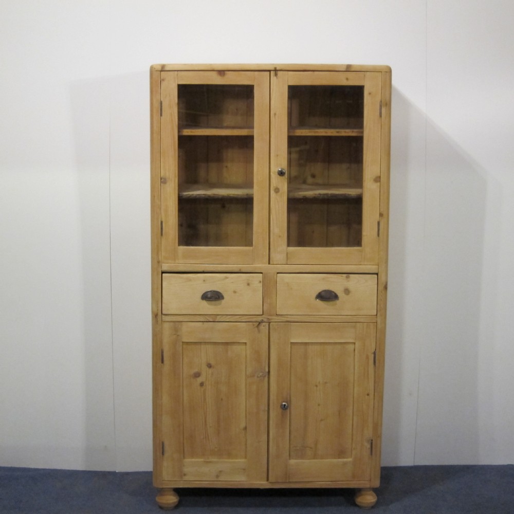 Large partly glazed pine cupboard