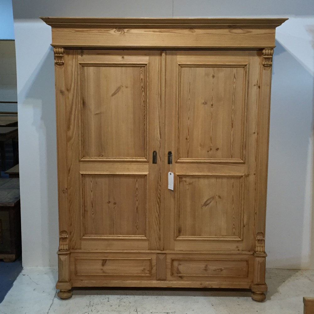 A Large, Low, Antique Pine Wardrobe 