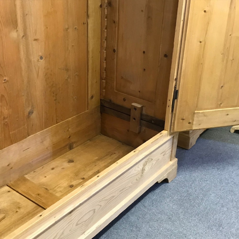 A DEEP DOUBLE ANTIQUE PINE WARDROBE (DISMANTLES) View III