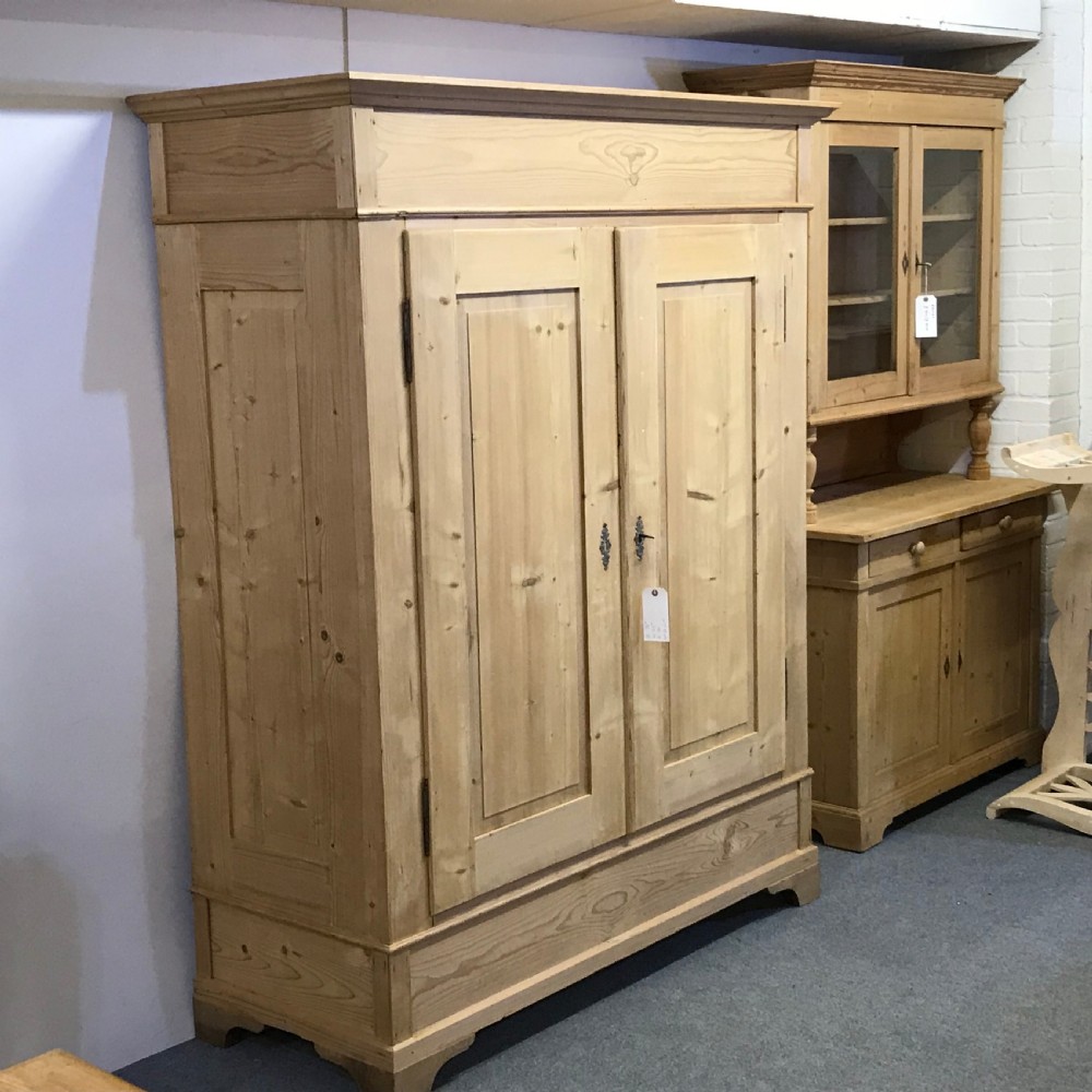 A DEEP DOUBLE ANTIQUE PINE WARDROBE (DISMANTLES) View V